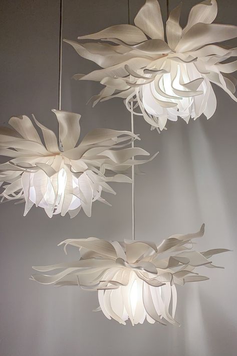 A highlight of LightArt's Artisan Collection, the Botanical Series features dazzling pendants inspired by the floral form. The Chartreuse Blossoms in creamy whites with subtle textural layers create an ethereal glow when illuminated. #interiordesign #architecture #design #lighting #handmade Flower Ceiling Lamp, Elegant Lighting Fixtures, Fleurs Diy, Home Decor Aesthetic, Flower Lamp, Deco Originale, Belek, Giant Flowers, Aesthetic Ideas