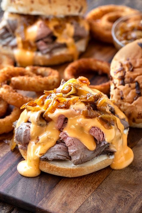 Roast Beef Sandwich with Cheddar Sauce | The Cozy Apron The Bear Sandwich, Roast Pork Sandwich Recipes, Roast Beef And Cheddar Sandwich, Hot Subs Sandwiches Ideas, Pub Sandwiches, Shaved Beef Sandwich, Sandwich Board Ideas, Roast Beef Poboy, Hot Roast Beef Sandwich