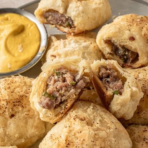 Australian Sausage Rolls Sausage Rolls Recipe Australian, Australian Sausage Rolls Recipes, Aussie Sausage Rolls, Australian Appetizers, Australian Sausage Rolls, Office Potluck Recipes, Super Bowl Potluck, Pickled Chicken, Easy Puff Pastry Recipe