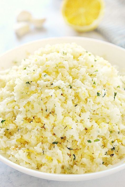 This Lemon Garlic Cauliflower Rice is made with just 4 ingredients! Perfect low-carb side dish that's bursting with flavor. Lemon Cauliflower Recipes, Flavored Cauliflower Rice, Lemon Cauliflower Rice, Garlic Cauliflower Rice, Garlic Cauliflower, Cauliflowers, Riced Cauliflower, Sweet Easy, Cauliflower Rice Recipes