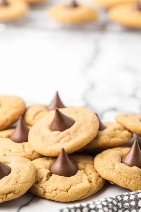 This easy and simple Peanut Butter Kiss Cookies are delicious and simple to make. The entire family will love this Peanut Butter Hershey Kiss Cookie recipe for Christmas! They are the best and are better than any cookies from Betty Crocker. #eatingonadime #cookierecipes #christmascookies Peanut Butter Hershey Kiss Cookies, Peanut Butter Kiss Cookies Recipe, 2023 Cookies, Kiss Cookie, Kiss Cookie Recipe, Peanut Butter Blossoms Recipe, Hershey Kiss Cookies, Peanut Butter Kiss, Key Lime Pie Easy