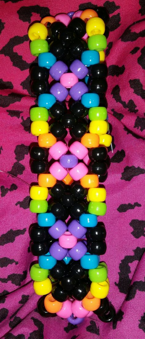 Psychedelic rainbow DNA kandi cuff Cuff Ideas Kandi, Cool Kandi Patterns, Ladder Cuff Kandi Pattern, Small Kandi Cuff, Rave Cuffs Kandi, Kandi Bracelets Patterns How To Make, Kandi Shoe Laces, Kandi Cuff Ideas Tutorial, Punk Kandi