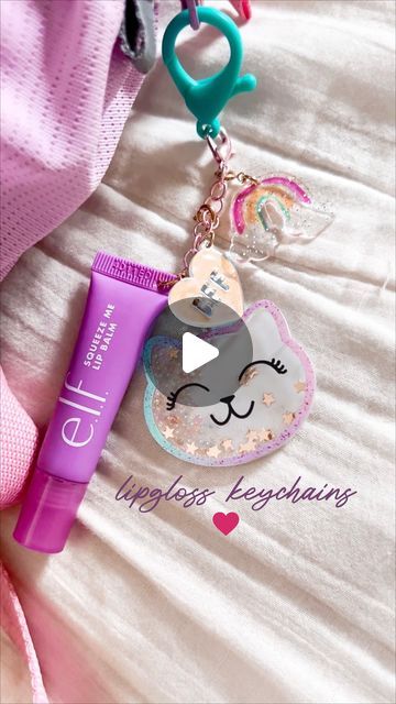 melissa fogelstrom ✨ a Magical Mess® on Instagram: "LIP GLOSS KEYCHAINS

➡️ Comment “SHOP” to have the supplies I used (and some other favorite charms) sent to your inbox! 

But can I just say I want one now too?! They are SO cute!! And would make for such a fun quality time/activity before back to school 🥰

HOW TO:
-poke a hole through bottom of lipgloss (a push pin is a good place to start and then I stretched it a bit more with a scissor)
-cut jewelry chain (I used a bracelet) down to the size you want your chain and add a jump ring and weave that through the lipgloss hole.
-use pliers to tighten that
-add your charms! 

If you have any other questions let me know! Are you going to try making them?! 

•
•
•
#trending #trend #viral #lipglosskeychain #diytutorial #girlsnight #diyactiviti Lip Gloss Holder Keychain Diy, Lipgloss Keychain, Time Activity, Scissor Cut, Halloween Charms, Jewelry Chain, Diy Activities, Hair Scarf, Diy Keychain