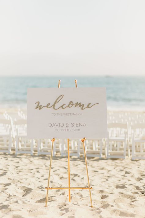 Wedding Beach Signs, Beach Wedding Entrance Ideas, Wedding Signs Beach, Welcome Sign For Beach Wedding, White Beach Wedding Decor, Wedding Welcome Sign Beach, Oceanfront Wedding Ceremony, Beach Wedding Signage, Beach Wedding Welcome Sign