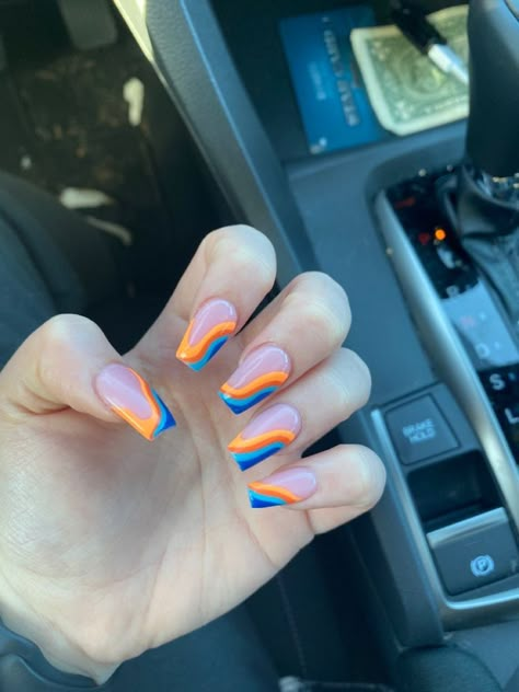 Trending Acrylic Nails Orange, Blue And Orange Short Nails, Neon Swirl Nails Acrylic, Orange Blue And Yellow Nails, Blippi Inspired Nails, Blue Nails With Orange Design, Blippi Nail Design, Retro Wave Nails, Blue And Orange Swirl Nails