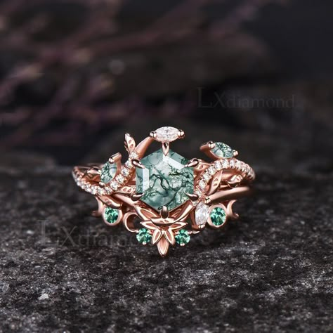 Item description ✦ Handmade, high-quality item! ✦ Material: 925 sterling silver, Solid 10k/14K/18K GOLD (can be made in white/rose/yellow gold) Engagement ring ✦ Center stone: Natural Green Moss Agate. ✦ Size/Weight: 6x6mm Hexagon Cut ✦ Side stones: Marquise Cut Natural Green Moss Agate and Marquise Cut/Round Cut Moissanites Wedding band ✦ Gemstones: Round Cut Lab Emeralds Any ring size can be made,if the ring size is not in the option list ,contact me. As it is handmade,it needs 3-4 weeks to finish and then be shipped by usps or DHL. Return policy: We offer 30 days return policy. For any reason, if you are not completely satisfied with your order, you may return it for a refund.  Buyer is responsible for the handcraft fee (15%-30% of the total price) and the return shipping cost. Green Moon Ring, Enchanted Forest Ring, Gold And Emerald Wedding Ring, Non Traditional Wedding Rings Engagement, Green Rings Engagement, Green And Gold Ring, Green Wedding Ring, Green Wedding Rings, Rose Gold Emerald Ring