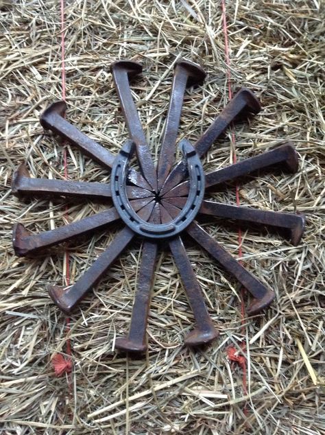 railroad spike crafts | Railroad spike bursting star with horse shoe. Check out American ... Railroad Spikes Crafts, Railroad Spike Art, Welding Crafts, Horseshoe Projects, Railroad Spikes, Horseshoe Crafts, Welding Art Projects, Metal Tree Wall Art, Horseshoe Art