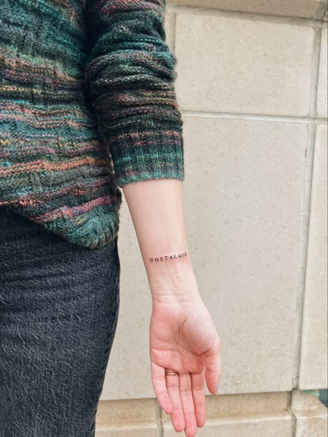 #wristtattoo #tattoo #tattooideas #tattooinspo #nostalgia #tinytattoo #smalltattoo #wordtattoo #tattoowork #delicatetattoos Nostalgia Ultra Tattoo, Nostalgia Tattoo Word, No Regrets Just Memories Tattoo, Nostalgia Tattoo, Writing Tattoos, Tattoo Work, Word Tattoos, Piercing Tattoo, Wrist Tattoos