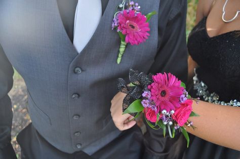 Homecoming time is here!! Order your corsages and boutonnière from countryside florist! Magenta Gerber daisies compliments this black dress! Corsage Homecoming Black Dress, Flowers For Black Dress Prom, Homecoming Corsages Wristlets, Prom Wrist Corsage Ideas Black Dress, Magenta Corsage And Boutonniere, Magenta Boutonniere, Prom Flowers Bouquet Black Dress, Corsage For Black Dress, Gerber Daisy Corsage