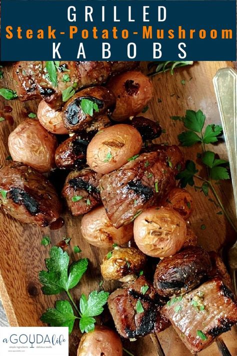 BEST marinated Steak, Potato, Mushroom Kabobs. Juicy grilled steak, mushrooms and potatoes loaded with delicious flavor. Easy meal on a stick. #steakkabob #steak #grilledsteak #steakandpotatokabobs #beefkabobs #easygrillingrecipes #kabobrecipes #agoudalife Steak And Potato Kabobs, Marinated Steak Kabobs, Potato Kabobs, Grilled Steak Kabobs, Mushroom Kabobs, Steak Mushrooms, Potatoes Loaded, Potato Mushroom, Greek Chicken Kabobs