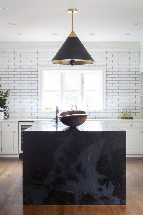 The diverse tones, textures, and grains of marble can bring a modern aesthetic to your kitchen island. It's a pretty timeless material too. Want proof a marble kitchen island can work anywhere and tips for accomplishing the look? #hunkerhome #marble #kitchen #kitchenisland #marblekitchenisland Waterfall Island Kitchen, Waterfall Countertop, Marble Kitchen Island, Waterfall Island, Black Island, Black Kitchen Island, Kitchen Island Ideas, White Kitchen Island, Prep Sink