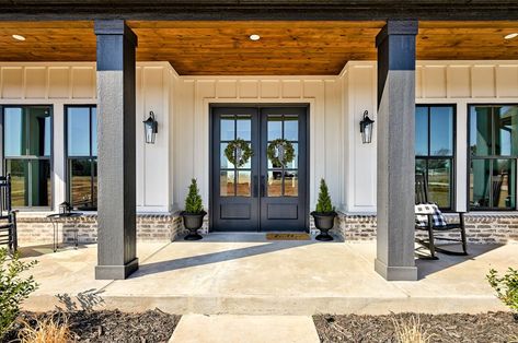 Black Beams Front Porch, Outdoor Front Porch Ideas Modern, Gray Columns Front Porch, Black Stained Porch Columns, Natural Wood Pillars Front Porches, Rambler Front Porch, Modern Farmhouse Exterior Front Porch, Homes With A Front Porch, Front Porch With Wood Columns