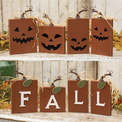 The Fall Pumpkin Blocks are a set of four decorative square wooden blocks with a rust-orange painted finish. The blocks have a reversible design, one side spelling “Fall” in dimensional white letters, and the other with black jack-o-lantern faces. The top of each pumpkin is detailed with a twisted resin stem, raffia tie, and green leaf for a complete look. These blocks are the perfect addition to the home during the Fall and Halloween season, bringing a festive touch to a riser, tray, shelf, or Wood Halloween Decorations Outdoor, Scrap 1x4 Wood Projects, Fall Wooden Pumpkins, Cool Wooden Projects, Small Fall Signs Wooden Diy, Fall Wood Block Crafts, 2x4 Fall Wood Crafts, Christmas Scrap Wood Projects, Fall Wood Blocks