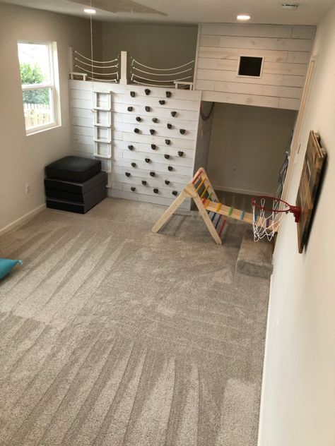 Grey, white, climbing wall with shiplap, hideout, loft, reading book Loft Fort Ideas, Tiny Home Playroom, Playroom Ideas Climbing Wall, Playroom Fort Loft, Barndominium Playroom, Playroom Fort Ideas, Indoor Play Loft, Playroom With Rock Wall, Indoor Loft Playhouse