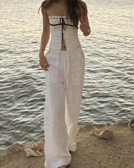 Women's Linen Summer Palazzo Trousers Flowy 2024 summer beach aesthetic cream beige white striped linen trousers outfit suggestions 2024 aesthetic summer evening outfit suggestions shopping suggestions For a chic summer evening look, consider pairing these linen palazzo trousers with a simple white camisole and a statement necklace. Add strappy sandals and a clutch bag to complete the outfit. This combination offers effortless elegance and is perfect for a night out or a special dinner on the be Linen Pants Aesthetic Outfit, Linen Outfits Aesthetic, Trouser Summer Outfits, Linen Trousers Aesthetic, Beige Flowy Pants Outfit, White Linen Pants Outfit Dressy, White Camisole Outfit, Flowy Outfits Aesthetic, White Linen Trousers Outfit