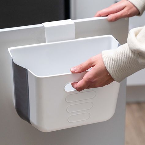 Description For a compact in-cabinet rubbish bin look no further than the Collapse-A Handy Rubbish Bin 6L. Ideal for use in a caravan, kitchen cabinet or drawer, this 6L wall-mounted rubbish bin is designed to either adhere to or hang from a cupboard door with a maximum thickness of 2cm. Complete with an integrated handle and tab to hold a bin bag in place, this garbage bin even partially collapses into the base to a minimum of 5cm making it a great space-saving solution whether you use it for scraps in the kitchen or as a caravan bin. Features: Material: Polypropylene Colour: White Capacity: 6L Maximum cabinet door thickness: 2cm Maximum depth: 15cm Minimum depth: 5cm Ideal for use on a cupboard door or in a drawer Integrated handle Integrated tab to hold bin bag Partially collapses into Kitchen Rubbish Bin, Bathroom Cupboard, Bin Storage, Cupboard Shelves, Clothes Racks, Over The Door Hooks, Bin Bag, Rubbish Bin, Integrated Handles