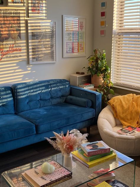 This Small Texas Rental Never Feels Dreary Thanks to Color and Disco Balls | Apartment Therapy Navy Blue Couch Aesthetic, Peacock Couch, Ottawa Apartment, 1940s House, Blue Couch Living Room, Blue Couch, Blue Velvet Sofa, Blue Couches, Blue Living Room