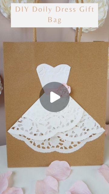 191K views · 10K likes | Catherine on Instagram: "DIY doily dress gift bag.  Following on from my Christmas tree doily gift bag I wanted to create another DIY doily gift bag which would be perfect for year round use.  This would be fab for weddings, hen parties, children's parties or even birthdays.   You will need: Doilies mine are from @hobbycrafthq Brown paper bags @georgehome Glue Glue dots Ribbon Flower  Or you could decorate with ribbon and pearls.  #diyvalentines #diygifts #wrappingpresents #diywedding #mothersday2024 #diygiftideas #giftwrappingideas #weddingdiy #wrappingideas  #giftwrapping #craftideas #craftingwithcatherine #homemadegifts #easydiy #princessparty #valentines2024 #cardboardcrafts #valentinescrafts #hobbycrafthq" Bridal Crafts Diy, How To Wrap Dress For Gift, Diy Decorated Gift Bags, How To Wrap Wedding Gifts, How To Wrap A Dress As A Gift, How To Decorate Gift Bags, Dress Packaging Ideas, Paper Bag Decorating Ideas, Diy Paper Bag Gift