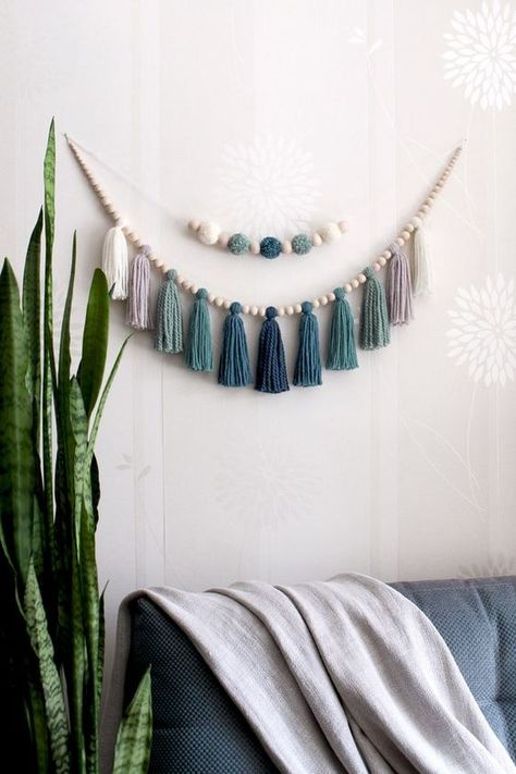 Blue Wall hanging over the bed wall decor.#Creativ #Dies # #WoodWorking #DIY #Crafts Wood Bed Garland, Wood Hanging Decor Wooden Signs, Hanging Tassels Decor, Nursery Tassel Garland, Over The Bed Garland, Wood Bead And Tassel Garland, Wood Garland Decor Ideas, Boho Nautical Nursery, Wood Bead Crafts Home Decor