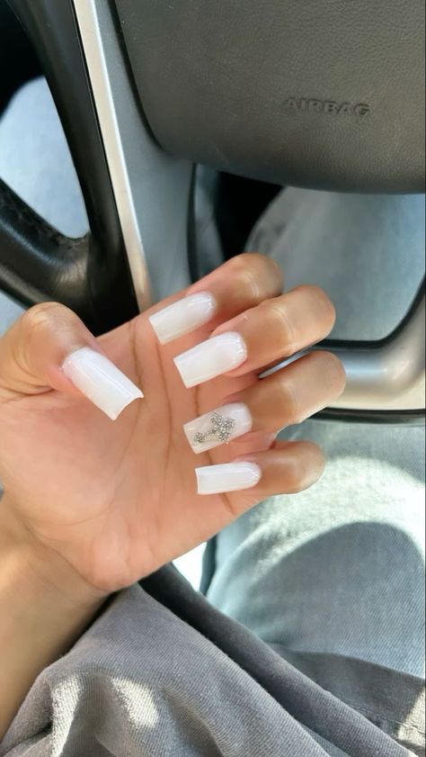 Cute White Nails French Tip, White Nails With Planet Charm, Milky White Nails With Cross, Plain White Nails With Charms, Milk White Nails With Rhinestones, White Nails With Cross Charm, Black And Milky White Nails, Milky White Nails With Gems, Nails Acrylic Cross