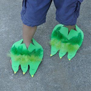 Dino (or Monster) Feet: These Dino / Monster feet are sure to provide plenty of amusement. They are such a simple idea - foam sheets cut into dinosaur feet shapes that can be slipped over the child's foot. Decorate using sharpies, adhesive foam shapes, glue, glitter, buttons, feathers.... A fantastic project for a preschool class, a dinosaur party or for pretend play on a rainy day.   As seen on Broogly: a great source of fun, inspirational and educational projects for kids: www.broogly.com Dinosaur Party Games, Storytime Crafts, Dinosaurs Preschool, Monster Crafts, Monster Theme, Dinosaur Activities, Foam Shapes, Dinosaur Crafts, Preschool Class