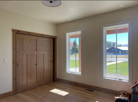 Wood Trim With Wood Floors, Raw Wood Baseboards, Stained Wood Trim Living Room, Painted Door Wood Trim, Stained Wood Baseboards, Wood Trim House, Stained Trim Interior, Wood Trim Modern, White Oak Interior Doors