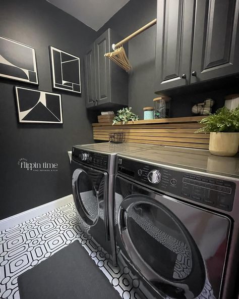 Incredible transformation in just two days! The decision to paint the walls ‘Iron Ore’ from @sherwinwilliams was spot on—it adds a dramatic and modern vibe. The sleek wood slat panel is a perfect way to hide the washer and dryer hookups, and it complements the bold geometric flooring perfectly. This laundry room makeover is seriously one of my favorites. #LaundryRoomMakeover #HomeTransformation #IronOre #SherwinWilliams #ModernDesign #DIYHome #InteriorInspo #LaundryRoomGoals #furnitureartis... Laundry Room Black Accent Wall, Black Washer Dryer, Washer Dryer Laundry Room, Black Accent Walls, Geometric Floor, Laundry Dryer, Iron Ore, Laundry Room Makeover, Laundry Room Design