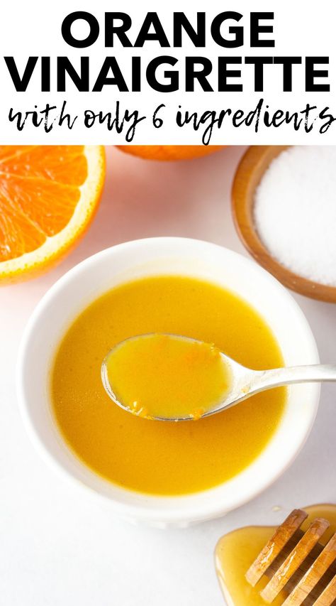 A small white bowl with orange vinaigrette in it, and a small spoon dipping into it. It's on a white background and surrounded by half an orange, a wooden bowl with kosher salt, and a honey stick with honey dripping off it. Orange Vinaigrette Dressing, Citrus Salad Dressing, Orange Vinaigrette, Delicious Salad Dressings, Citrus Vinaigrette, Citrus Dressing, Spinach Salad Recipes, Vinaigrette Salad, Simple Vinaigrette