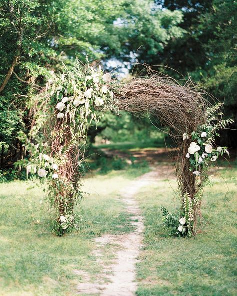 At this cattle farm wedding in Mississippi, an old logging tool that belonged to the bride's grandfather was decorated with grapevines, peonies, garden roses, and veronica. Branch Arch Wedding, Simple Wedding Arch, Wedding Chuppah, Cattle Farm, Wedding Branches, Wedding Arch Rustic, Romantic Wedding Ceremony, Wedding Arches, Wedding Arbour