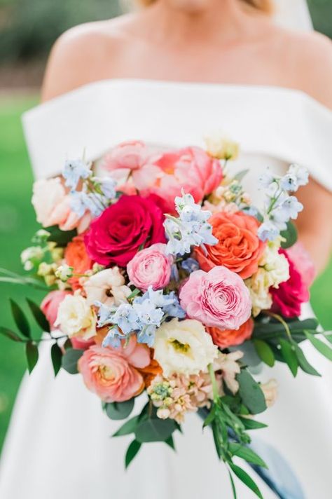 Bride with colorful spring bouquet at Camp Lucy Wedding Bouquet Spring, Colorful Spring Wedding, Blue Taper Candles, Colorful Wedding Bouquet, Camp Lucy, Spring Wedding Bouquets, Coral Peonies, Blue Delphinium, Brides Bouquet