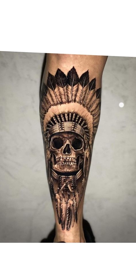 Indian Theme Tattoo Sleeve, Skull Calf Tattoo Men, Skull And Feather Tattoo, Men Shin Tattoo Ideas, Skull Shin Tattoo, Men’s Shin Tattoo, Skull Calf Tattoo, Calf Tattoo Men Ideas, Devil Tattoo Men