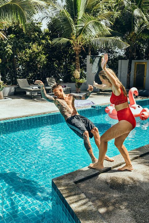 Woman Pushing Man Into Swimming Pool | Stocksy United Ping Pong Photography, Swimming Reference, Swimming Pool Photoshoot, People From The Past, Pool Shoot, Pool Photoshoot, Couples Kiss, Boyfriend Instagram, Wedding Happy