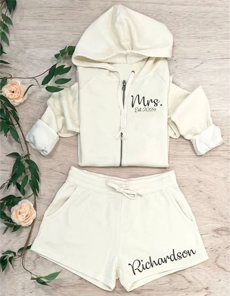 Bridal Party Set, Bridesmaid Pajamas, Wedding Day PJs, Bride Outfit, Matching Bridal Party Shorts, Maid of Honor, Mother of Bride or Groom These are lightweight, not a heavy thick cotton making them great for springtime or cool summer nights as well   ....please note, the cream is just a touch see through due to the lightweight fabric.   These are WOMENS sizes, so make sure you are referring to the sizing chart. If you are familiar with womens sizing, then order your TRUE to size for womens. If you are used to more of a unisex size, the we urge you to order up one size. I cannot stress enough to check the sizing chart when ordering, as these are custom orders, so no returns or exchanges will be approved, as I am sure you can understand :)  Longer names will appear a bit smaller, as we scal Bridesmaid Pjs Pajama Set Fall, Wedding Party Matching Pjs, Maid Of Honor Engagement Party Outfit, Wedding Bride Outfit Ideas, Western Getting Ready Wedding Outfit, Bride After Party Outfit Comfy, Matching Bridesmaids Getting Ready, Bridal Weekend Outfits, Comfy Reception Outfit Bride