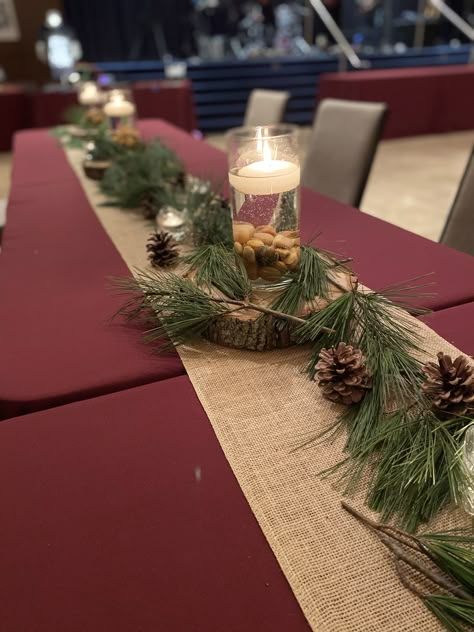 Burgundy And Pine Cone Wedding, Wedding Centerpieces With Pinecones, Pine Branch Table Decor, Pine Tree Table Decorations, Pine Table Runner, Rustic Winter Birthday Party, Table Decor With Pine Cones, Pine Branch Centerpiece, Pine Decoration Ideas Wedding