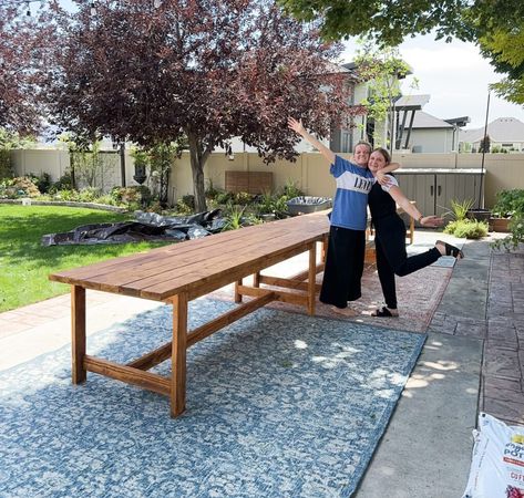 Simple Outdoor Table with Plans - SPetrichHome Diy Long Outdoor Dining Table, Large Outdoor Table Diy, Outdoor Diy Table, Outdoor Prep Table Diy, Easy Farmhouse Table, Long Patio Table, Diy Outdoor Table Dining, Long Outdoor Table, Outdoor Dining Area Ideas