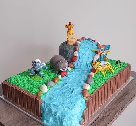 Sheet cake with waterfall design and lion guard main characters Lion Sheet Cake, Lion Guard Cake Ideas, Lion Gaurd Cake, Lion Guard Birthday Party Ideas, Lion King Birthday Cake, Lion Guard Cake, Rory Birthday, Lion Guard Birthday Party, Vanilla Sheet Cake