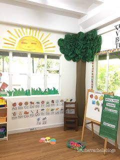 Daycare Nature Decor, Eric Carle Playroom, Preschool Natural Classroom Ideas, Eric Carl’s Classroom Theme, Nature Theme Preschool Classroom, Nature Preschool Classroom Decor, Eric Carle Classroom Theme Decor, Prek Classroom Door Ideas, Eric Carle Nursery