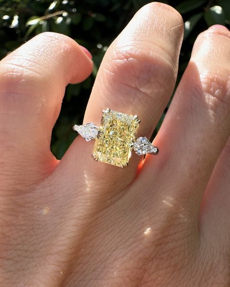 Swipe for more angles of this stunning yellow Radiant cut. 2.57ct yellow radiant cut diamond with kite side stones set in 14k yellow gold & platinum. #radiantcut #radiantcutdiamond #radiantcutdiamond #engagementring #diamondring #proposal #showmeyourrings #gettingmarried #howtheyasked #bridetobe #theknotrings #imengaged #theysaidyes #isaidyes #engaged #customjewelry #finejewelry Engagement Rings With Yellow Stones, Yellow Stone Engagement Rings, Radiant Yellow Diamond Ring, Yellow Canary Diamond Ring, Kite Side Stones, Canary Engagement Ring, Canary Diamond Engagement Ring, Canary Diamond Ring, Canary Diamond