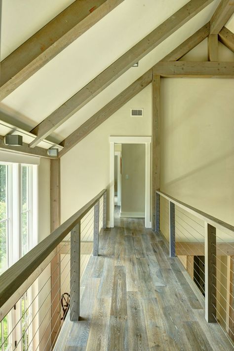 Contemporary catwalk in the Southold barn home. Visit to see more on this spectacular barn home, including floor plans. #barnhouseplans 40x50 Barndominium, Catwalk House, Barndominium Texas, Building Barndominium, Wire Railing, Barndominium Cost, Texas Barndominium, Post And Beam House, Beam House