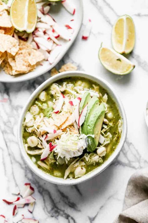 This warm and hearty chicken Pozole Verde is a Mexican stew that's easy to make and includes a mild green chile broth, shredded chicken, hominy. Chicken Pozole Verde Recipe, How To Make Pozole, Chicken Pozole Verde, Chicken Pozole Recipe, Pozole Verde Recipe, Cool Diet Recipes, Homemade Calzone, Chicken Pozole, Pozole Verde