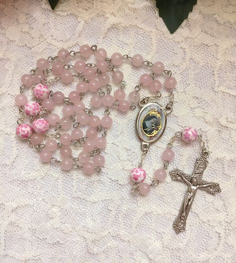 Handmade St. Rita of Cascia rosary beads made with 6mm pink Rose Quartz beads and 8mm ceramic pink & white floral beads. The center and crucifix are both made in Italy. Pink Rosary Aesthetic, Rosary Aesthetic, Rita Of Cascia, Pink Rosary, Flower Rosary, Saint Rita, St Rita Of Cascia, Pink Core, Soft Pink Theme