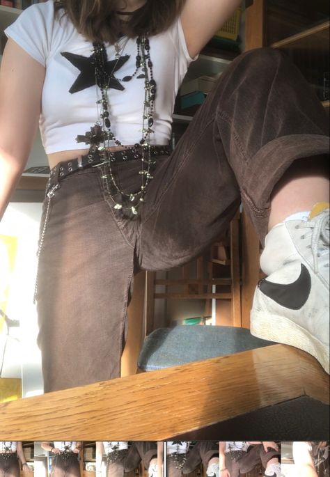 A mid-sized person/girl wearing a white crop top with a black star on it, dark brown jeans, a light brown flannel, Nike blazers and multiple crystal rings and bracelets. 		The person is also wearing multiple silver necklaces, a big one in form of a cross. Jadecore Outfits, Grunge Lesbian Outfit, Chaotic Aesthetic Outfits, Earth Grunge Outfits, Earth Aesthetic Outfit, Light Grunge Outfits, Chaotic Academia Aesthetic Outfit, Retreat Photoshoot, Chaotic Academia Outfits