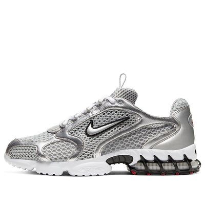 The Nike Air Zoom Spiridon Cage 2 Metallic Silver combines retro flair with futuristic design. Crafted for men, this sneaker features a mesh and synthetic leather upper coated in a sleek metallic silver finish. The raised Swoosh branding on the quarter panel adds a bold touch. Underfoot, a white foam midsole houses a caged Zoom Air unit in the heel for cushioning. The rubber outsole introduces hits of red for a pop of color. Whether you’re hitting the streets or making a style statement, these k Silver Nike Sneakers, Nike Spiridon Cage 2 Outfit, Nike Air Zoom Spiridon Cage 2, Silver Sneakers Outfit 2024, Silver Sneakers Outfit, Chrome Shoes, Nike Air Zoom Spiridon, Nike Gym Shoes, Gym Sneakers