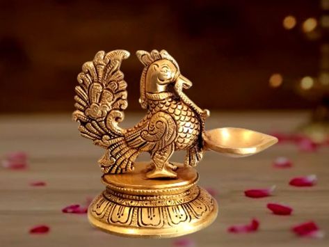 Call and Buy : 7397133820 . Brass Designer Peacock Diya . Enhance the festive season with unique collections of home decors that adds traditional touch to the place. Peacock Lamp, Brass Diyas, Brass Peacock, God Idols, Diya Lamp, Diwali Decorations, Coimbatore, Oil Lamps, Festive Season