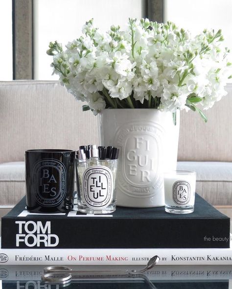 coffee table styling, diptyque candles, tom ford book, #interior #inspo Tom Ford Book Decor Coffee Table Styling, Tom Ford Coffee Table Book, Diptyque Candles Decor, Tom Ford Book, Diptyque Decor, Elegant Table Decorations, Diptyque Candles, Antique Brass Chandelier, Candles Decor