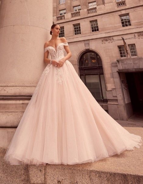 One of the latest designs for 2023.

Stunning.

A dreamy tulle ballgown dress with flattering off-the-shoulder sleeve detail.

Featuring exquisite floral lace appliques that decorate the bodice and continue throughout the skirt.

This style offers the perfect romantic and whimsical bridal style.

Available in Light Pink/Champagne or Ivory/Ivory Ballgown Dress, Tulle Ballgown, Ronald Joyce, Princess Bride, Ball Gown Dresses, Pink Champagne, Sleeve Detail, Lace Applique, Bridal Style