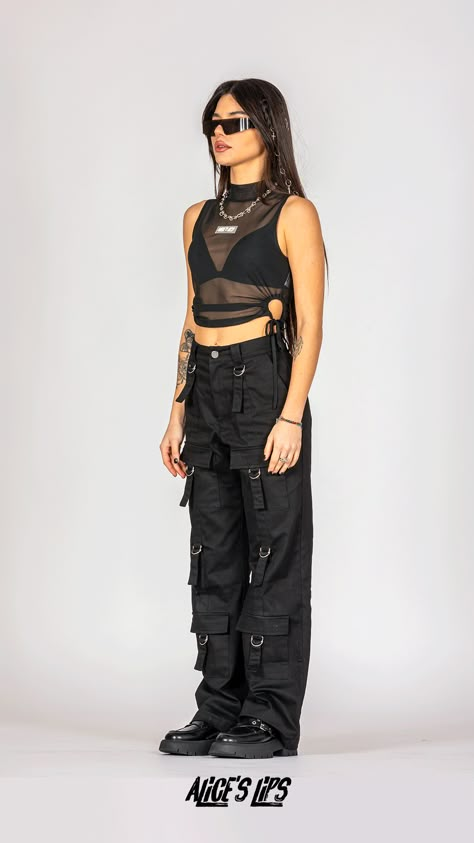 This Euphoria Mesh Top is the ultimate punk statement! With a high neck, cropped fit, cut-out waist, and tie-up ruched detail, it's edgy AF. Made of polyester fabric, sleeveless and bodycon fit, it's perfect for mosh pits and stage dives. The model is 5'3 (164 cm) and she wears a size XSmall. True to size. If you’re between sizes, we recommend sizing up. Mesh Black Outfit, Black Leather Rave Outfit, Cool Rock Outfits, Music Gig Outfit, Cool Punk Outfits, Styling Mesh Top, Cargo Pants Rave Outfit, Festival Outfits Pants, Mid Size Rave Outfits