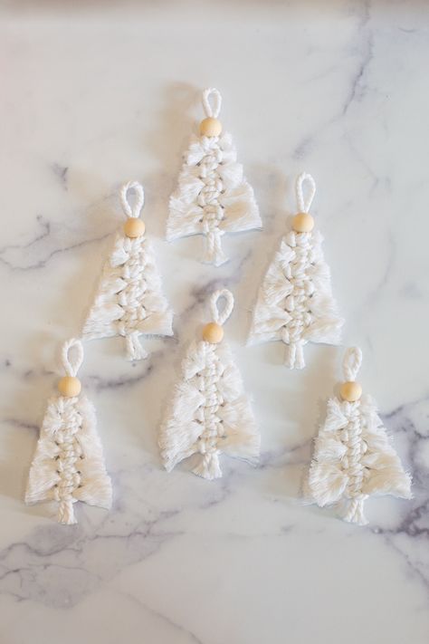 These woven Christmas trees make lovely decor, present toppers, or gifts. Click to learn how to make macrame Christmas ornaments. They're easy to make and look beautiful as holiday decor. Christmas Macrame Decorations, Small Macrame Christmas Tree, Easy Macrame Christmas Decorations, Easy Christmas Macrame Ideas, Easy Macrame Christmas Ornaments, Macrame Christmas Ornaments Tutorials, Macrame Christmas Decorations Tutorial, Easy Macrame Ornaments, Easy Macrame Christmas Tree