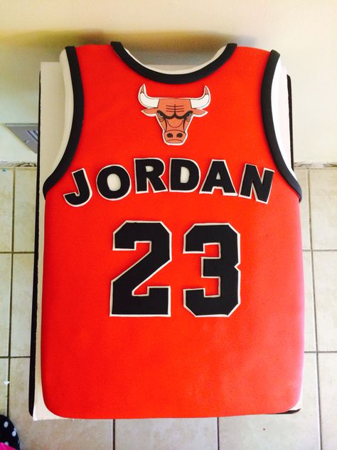 JORDAN JERSEY CAKE Jersey Cake Ideas, Basketball Jersey Cake, Michael Jordan Cake, Jordan Cake, Basketball Theme Birthday, Jersey Cake, Air Jordan Logo, Basketball Theme Party, Basketball Floor