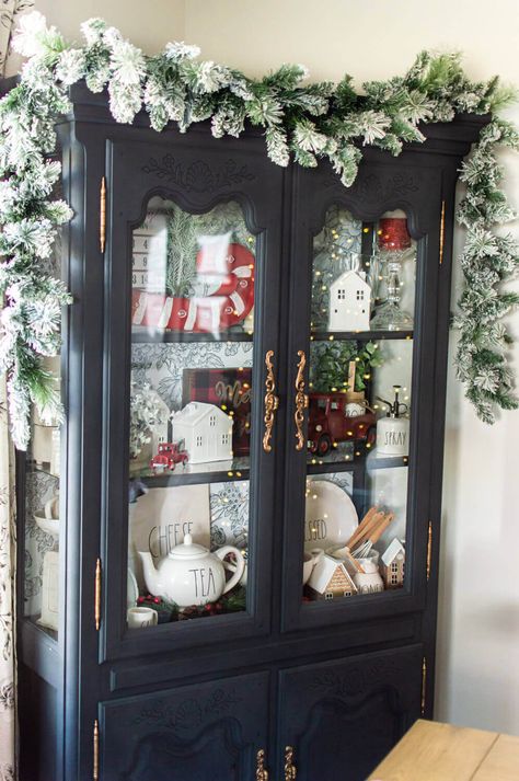 China Cabinet Christmas Decor / ahostinghome.com | christmas decor. christmas decor ideas. christmas decorations. christmas decor ideas diy. christmas decor ideas for living room. christmas decor ideas 2021 trends. christmas. christmas aesthetic. china cabinet. china cabinet decor. china cabinet display. christmas china cabinet display. christmas china hutch. christmas china hutch decor. christmas china cabinet decor. red and white christmas decor. red and white christmas decor ideas. Christmas China Cabinet Display, Curio Cabinet Christmas Decor, Christmas China Cabinet, Christmas Garland On China Cabinet, China Cabinet Christmas Display, Decorate Hutch For Christmas, Holiday China Cabinet Display, Christmas China Cabinet Decor, China Cabinet Christmas Decor